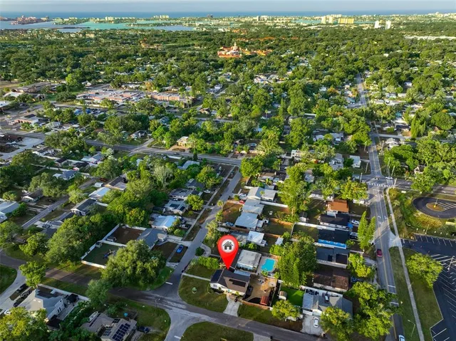 an aerial view of a houses with a lake view