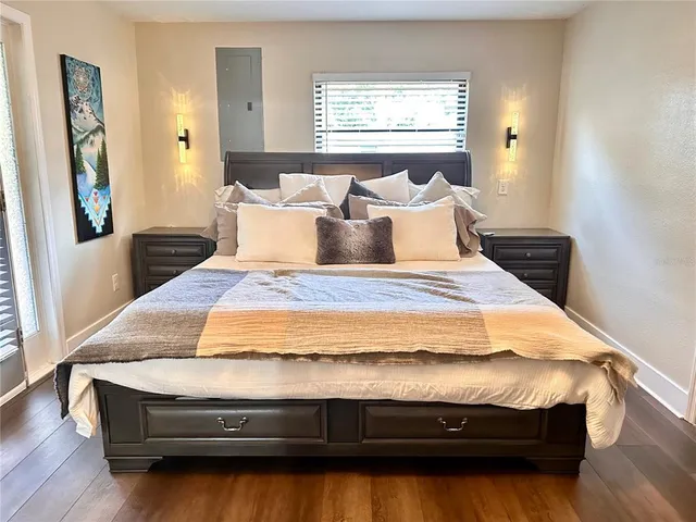 a bedroom with bed and window