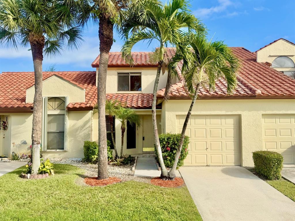 10253 Riverbend Terrace Boca Raton, FL 33498 - Photo 1 of 33 a front view of a house with garden
