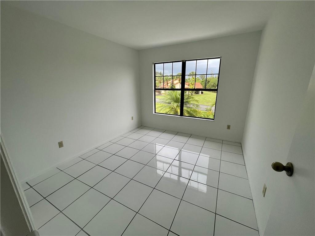 10253 Riverbend Terrace Boca Raton, FL 33498 - Photo 22 of 33 a view of an empty room and window