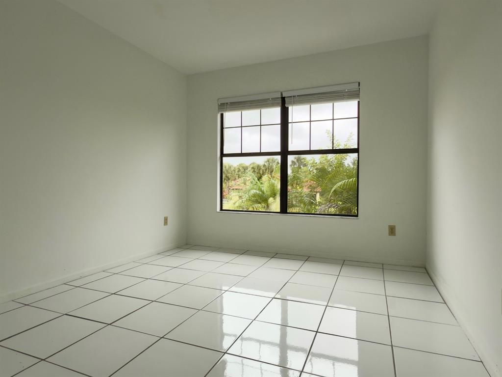 10253 Riverbend Terrace Boca Raton, FL 33498 - Photo 23 of 33 a view of an empty room with a window