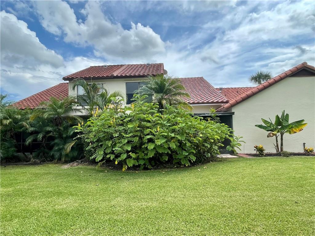 10253 Riverbend Terrace Boca Raton, FL 33498 - Photo 28 of 33 a view of a garden in front of a house