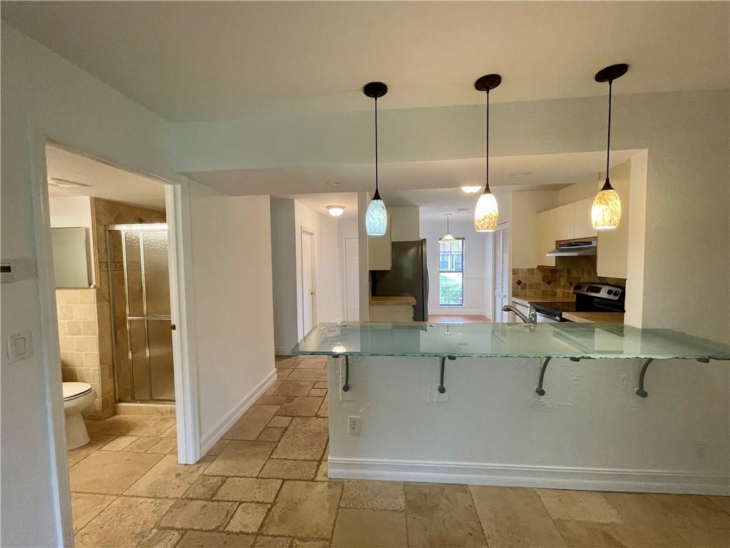 10253 Riverbend Terrace Boca Raton, FL 33498 - Photo 8 of 33 a view of a living room and kitchen view