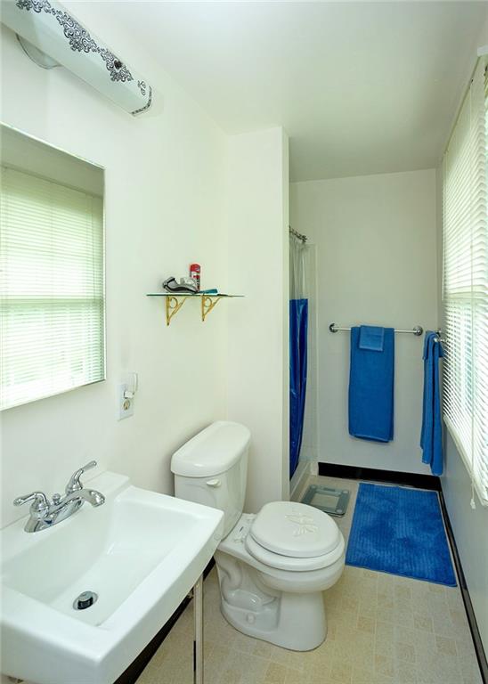 5876 Claridge Export Road Export, PA 15632 - Photo 19 of 25 Located on the upper level is a full bathroom with walk-in shower.