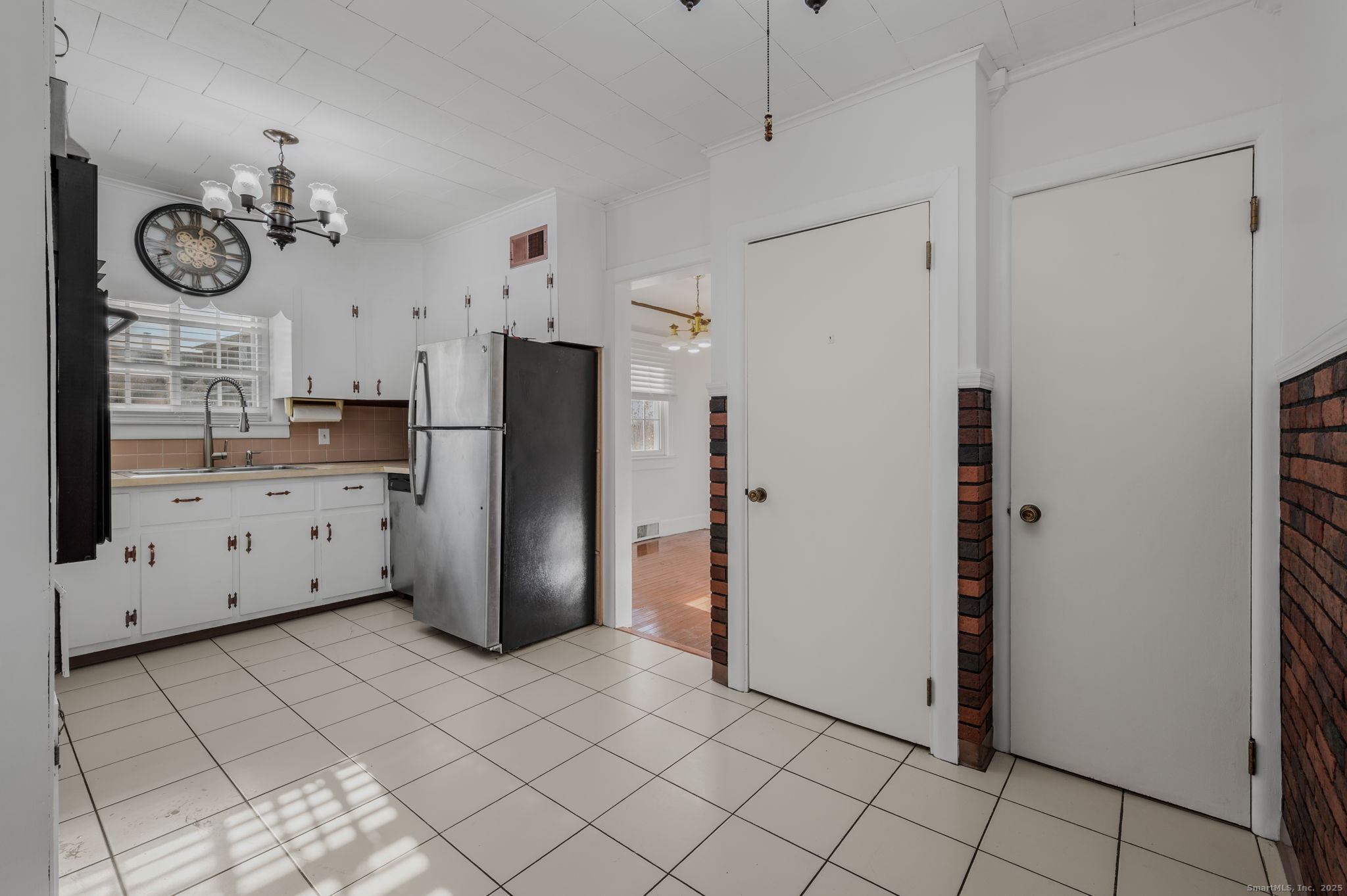 139 Pennsylvania Avenue East Lyme, CT 06357 - Photo 16 of 28 a view of a kitchen with refrigerator and cabinets
