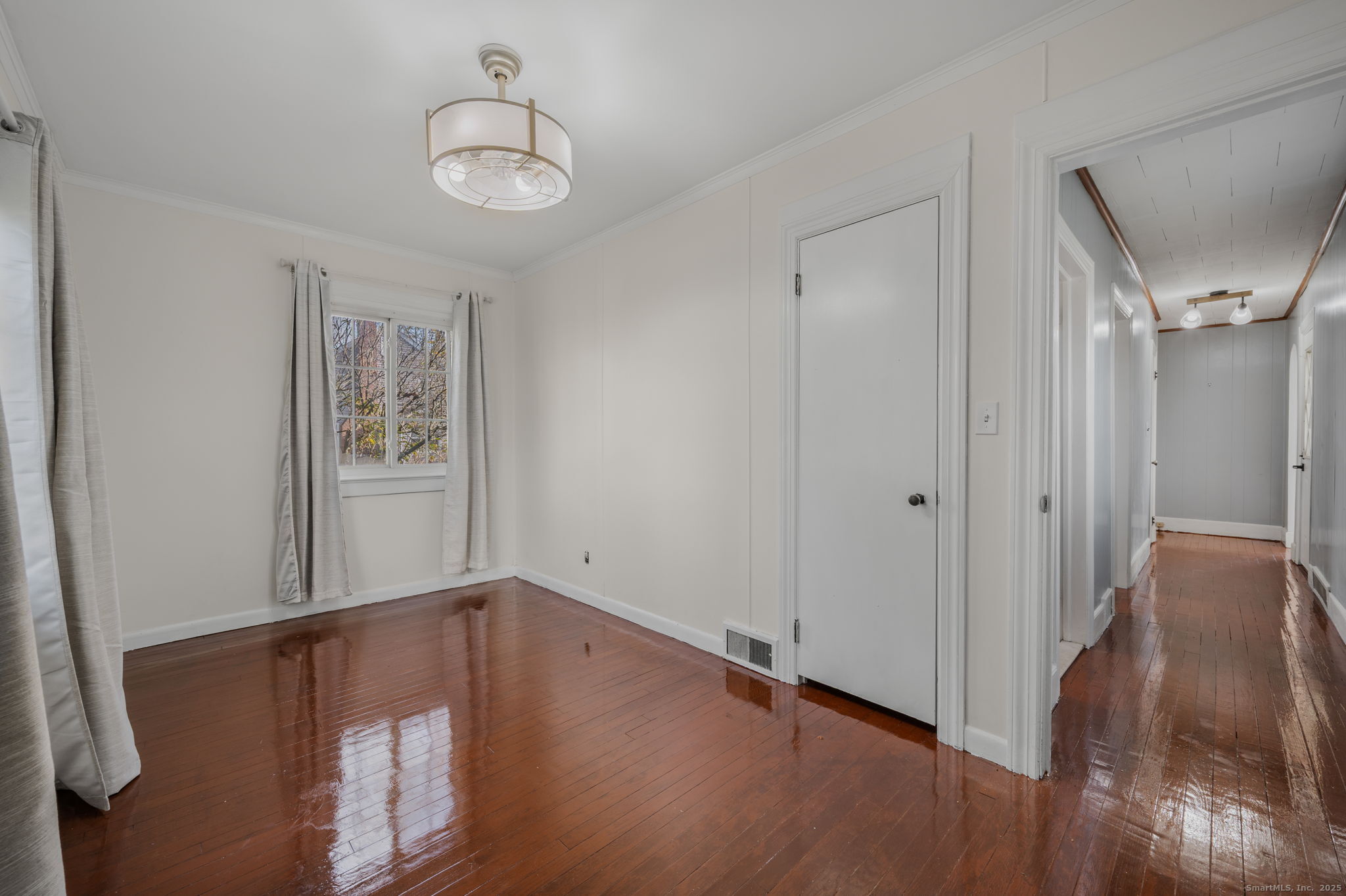 139 Pennsylvania Avenue East Lyme, CT 06357 - Photo 18 of 28 a view of empty room with wooden floor and fan