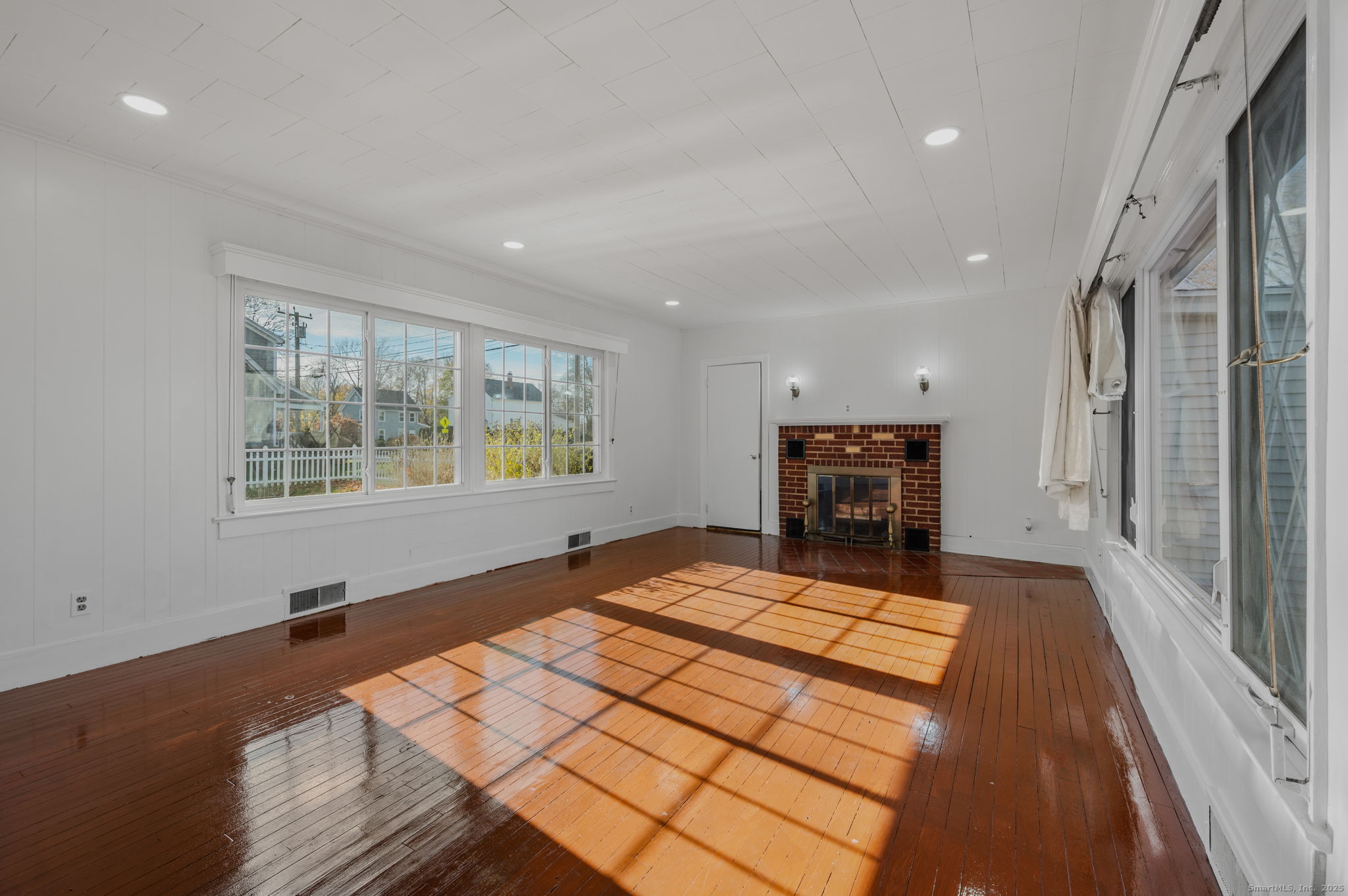 139 Pennsylvania Avenue East Lyme, CT 06357 - Photo 4 of 28 a bed room with a bed and wooden floor