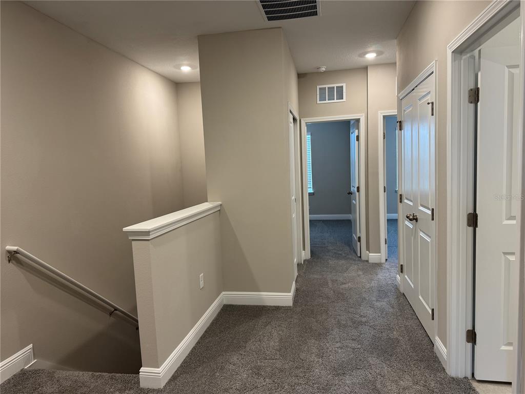 16434 Hamlin Hills Road Winter Garden, FL 34787 - Photo 31 of 50 a view of a hallway with closet and entryway