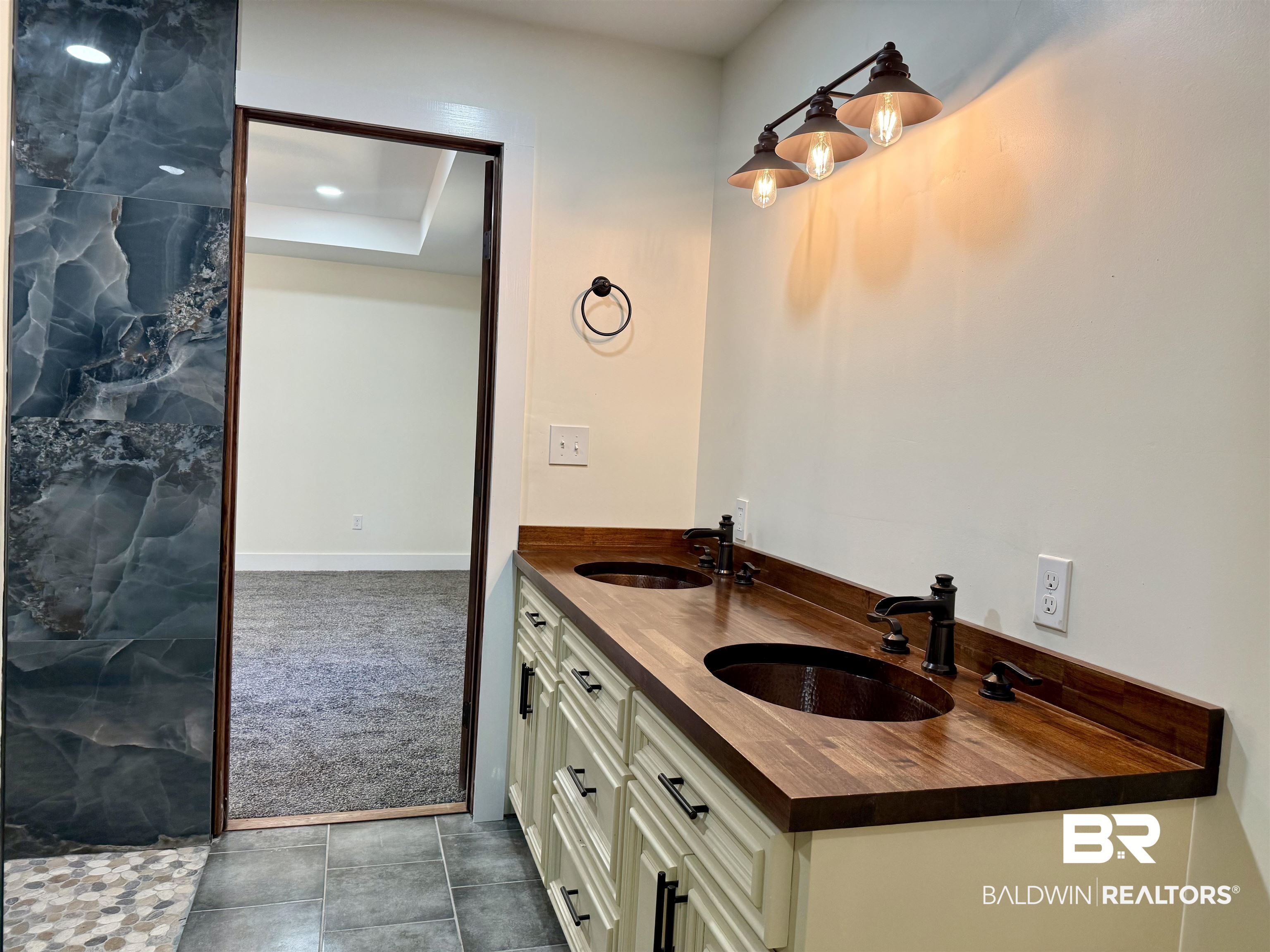 613 Forrest Avenue Brewton, AL 36426 - Photo 15 of 22 Bathroom featuring dark colored carpet and double vanity