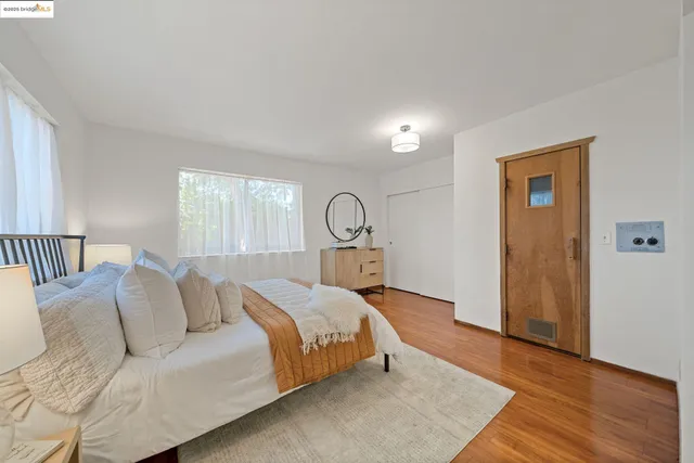 a bed room with a bed and a window