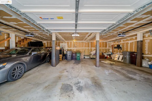 a view of parking garage with cars