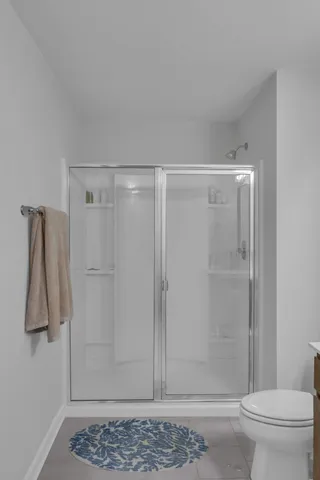 a view of walk in closet with clothes