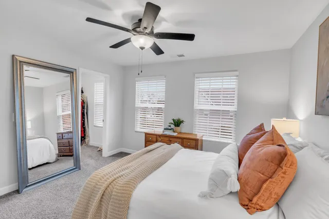 a bedroom with a bed and a book shelf