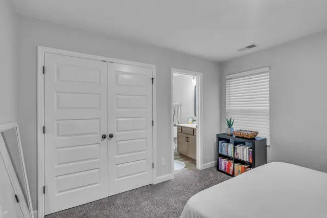 a view of a patio with table and chairs under an umbrella