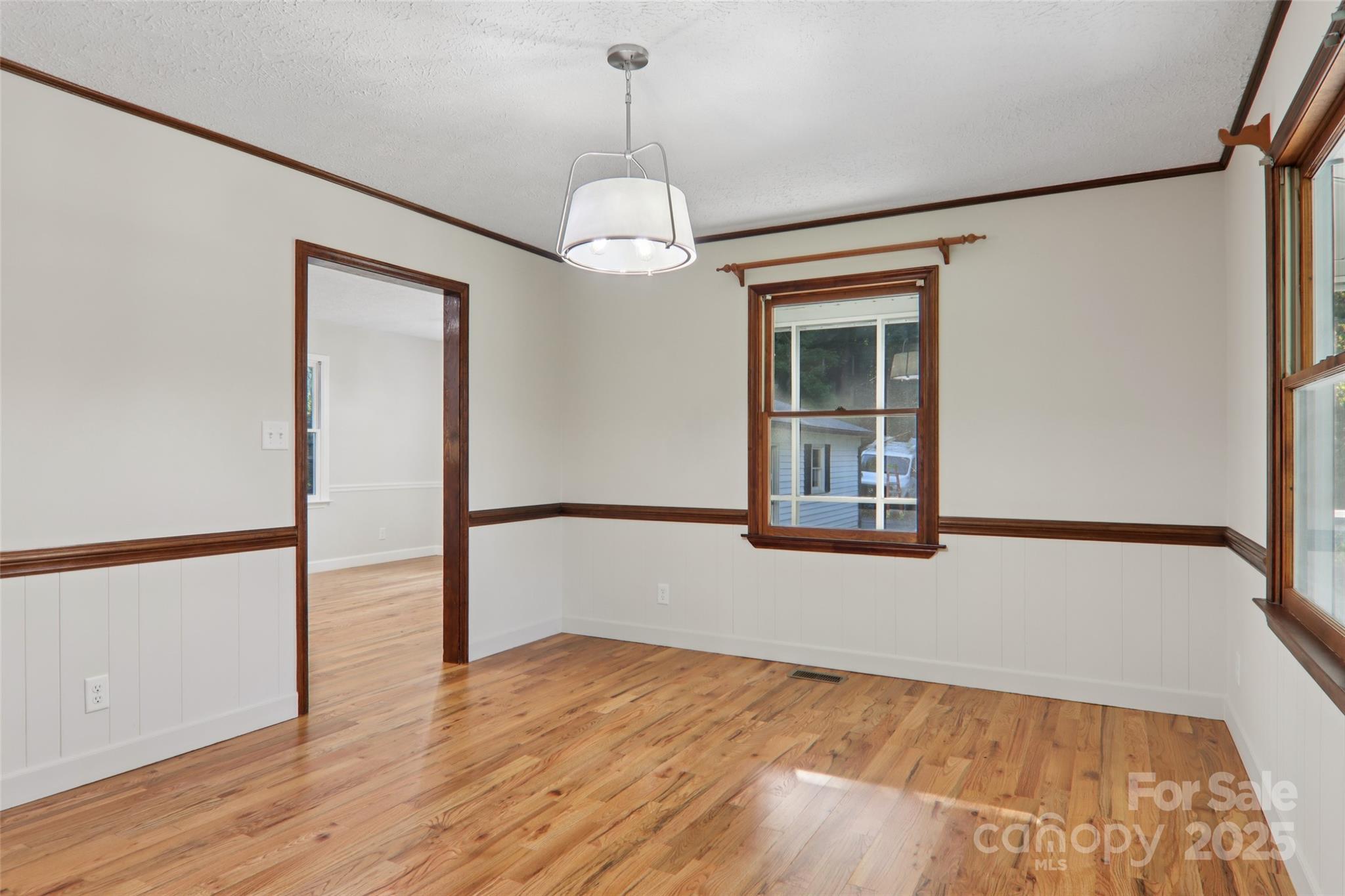 5 Timothy Lane Candler, NC 28715 - Photo 19 of 48 a view of an empty room with wooden floor and a window