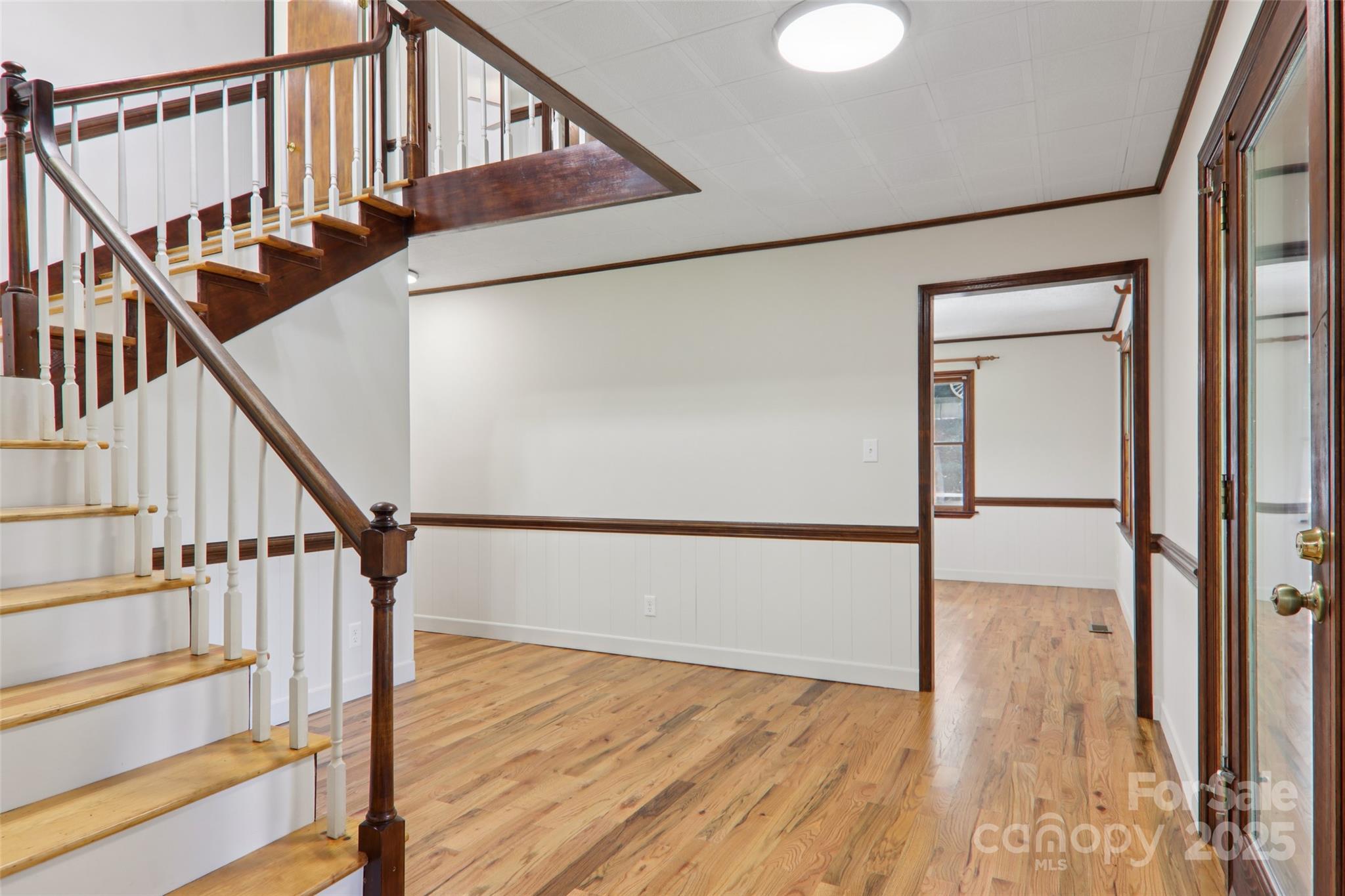 5 Timothy Lane Candler, NC 28715 - Photo 22 of 48 a view of staircase with wooden floor and white walls