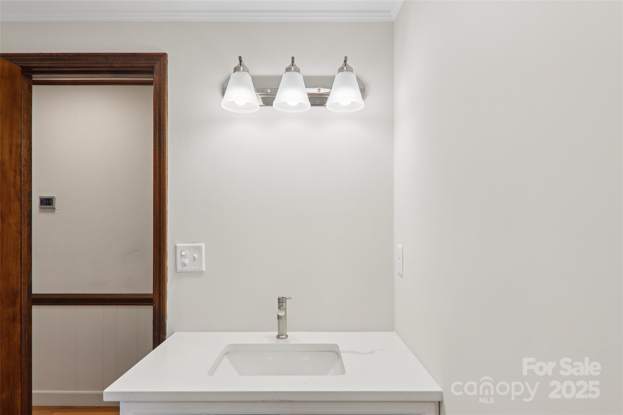 5 Timothy Lane Candler, NC 28715 - Photo 23 of 48 a bathroom with a sink and mirror