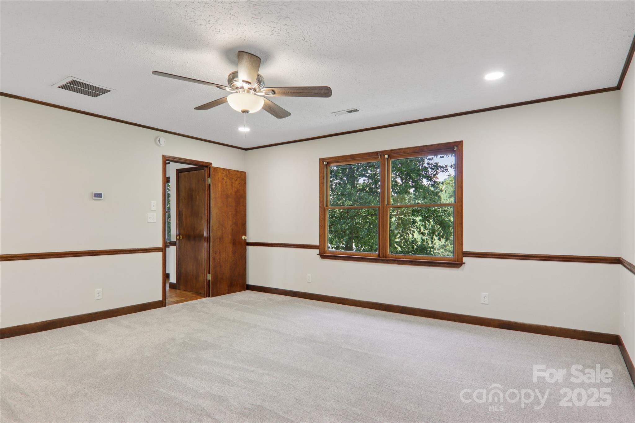 5 Timothy Lane Candler, NC 28715 - Photo 33 of 48 a view of a livingroom with a ceiling fan and window