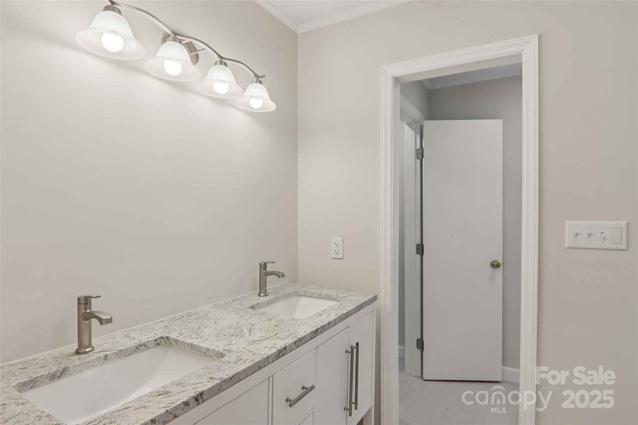 5 Timothy Lane Candler, NC 28715 - Photo 37 of 48 a bathroom with a granite countertop sink and a mirror