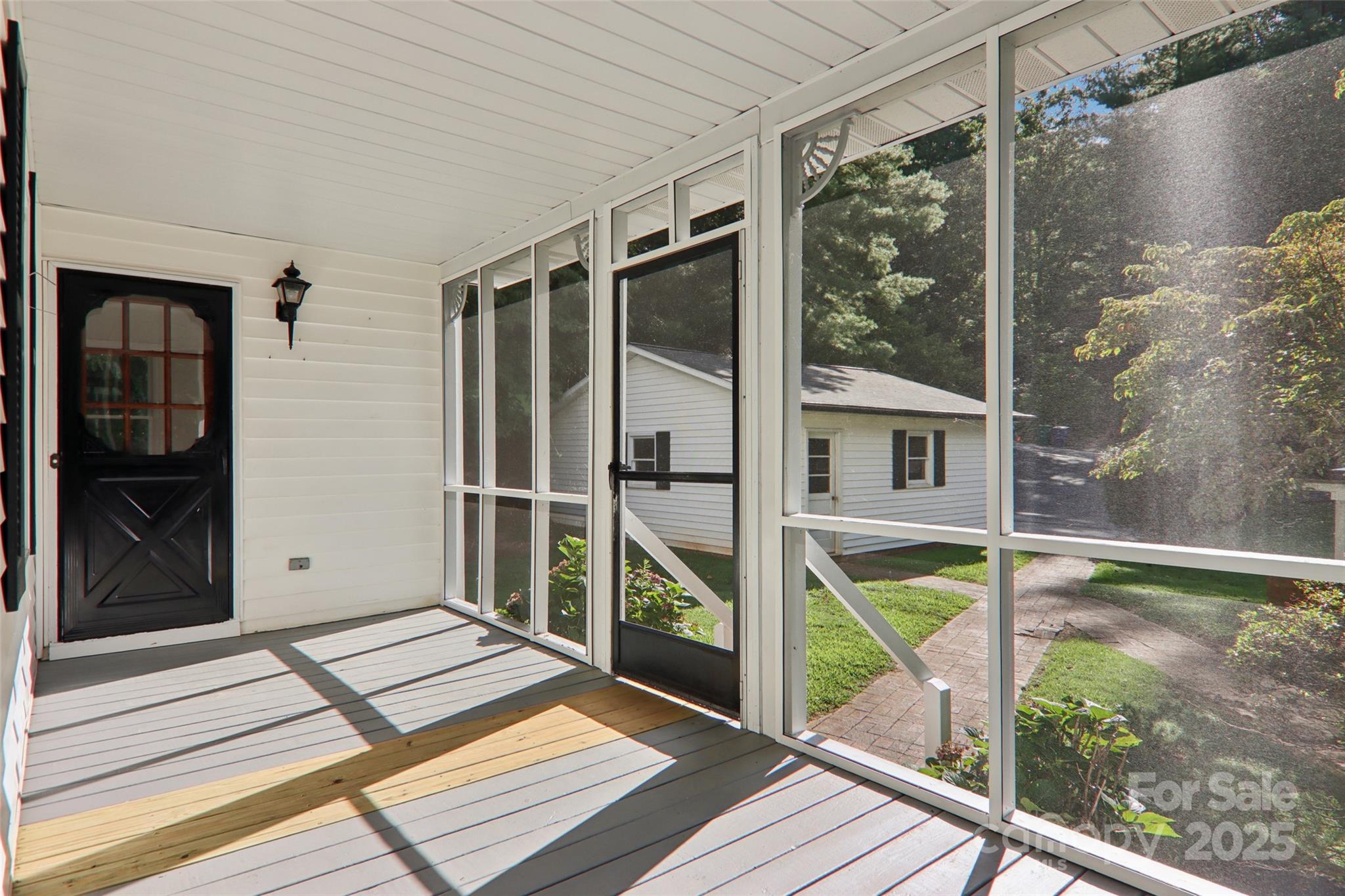 5 Timothy Lane Candler, NC 28715 - Photo 40 of 48 a view of balcony with two large trees and wooden floor