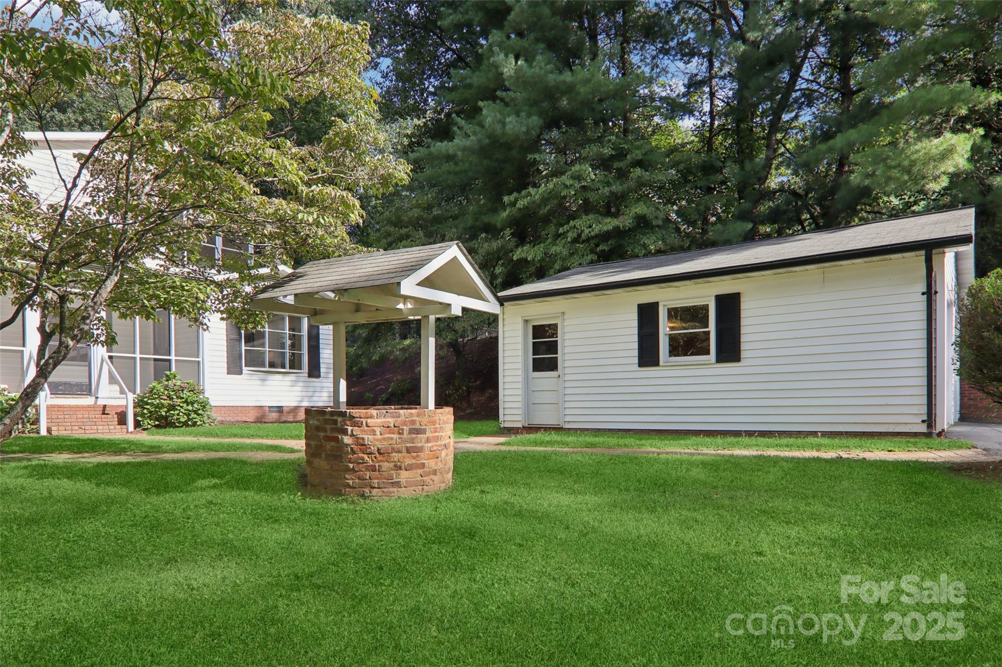 5 Timothy Lane Candler, NC 28715 - Photo 4 of 48 a front view of house with a garden