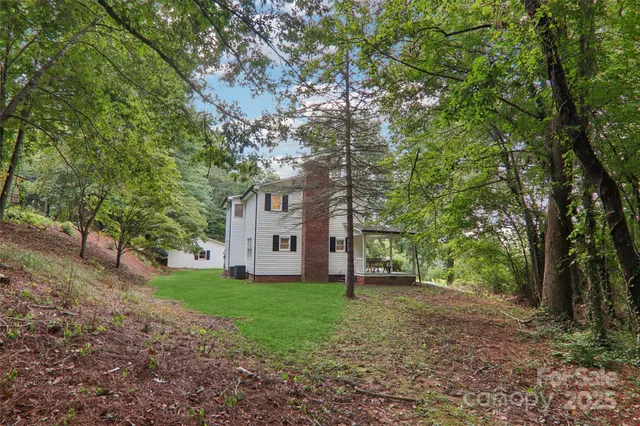 a view of an trees with a house