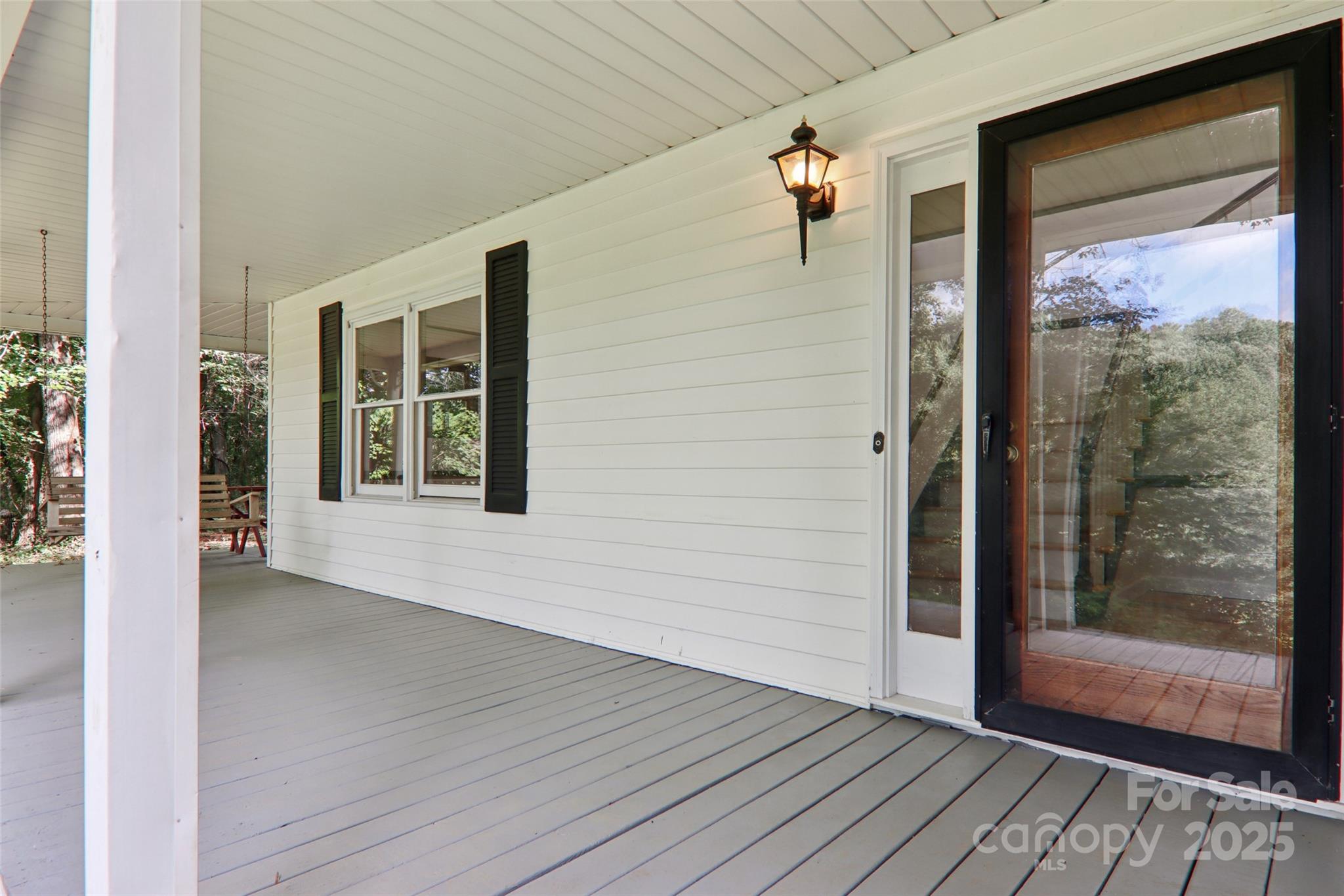 5 Timothy Lane Candler, NC 28715 - Photo 47 of 48 a view of front door and porch with wooden floor
