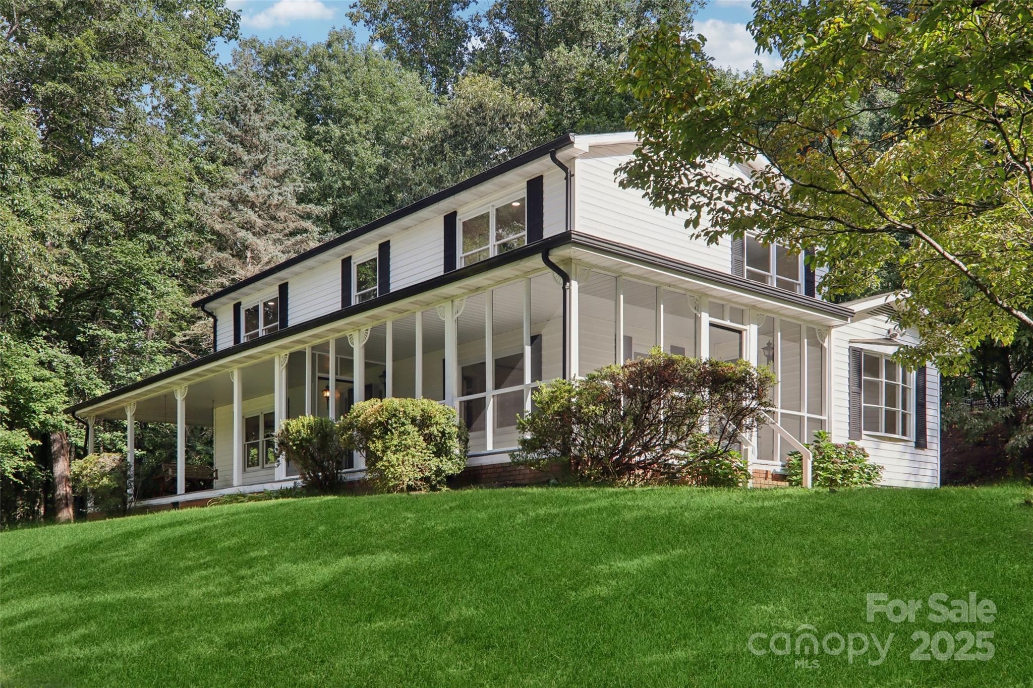 5 Timothy Lane Candler, NC 28715 - Photo 5 of 48 a view of a house with backyard and garden