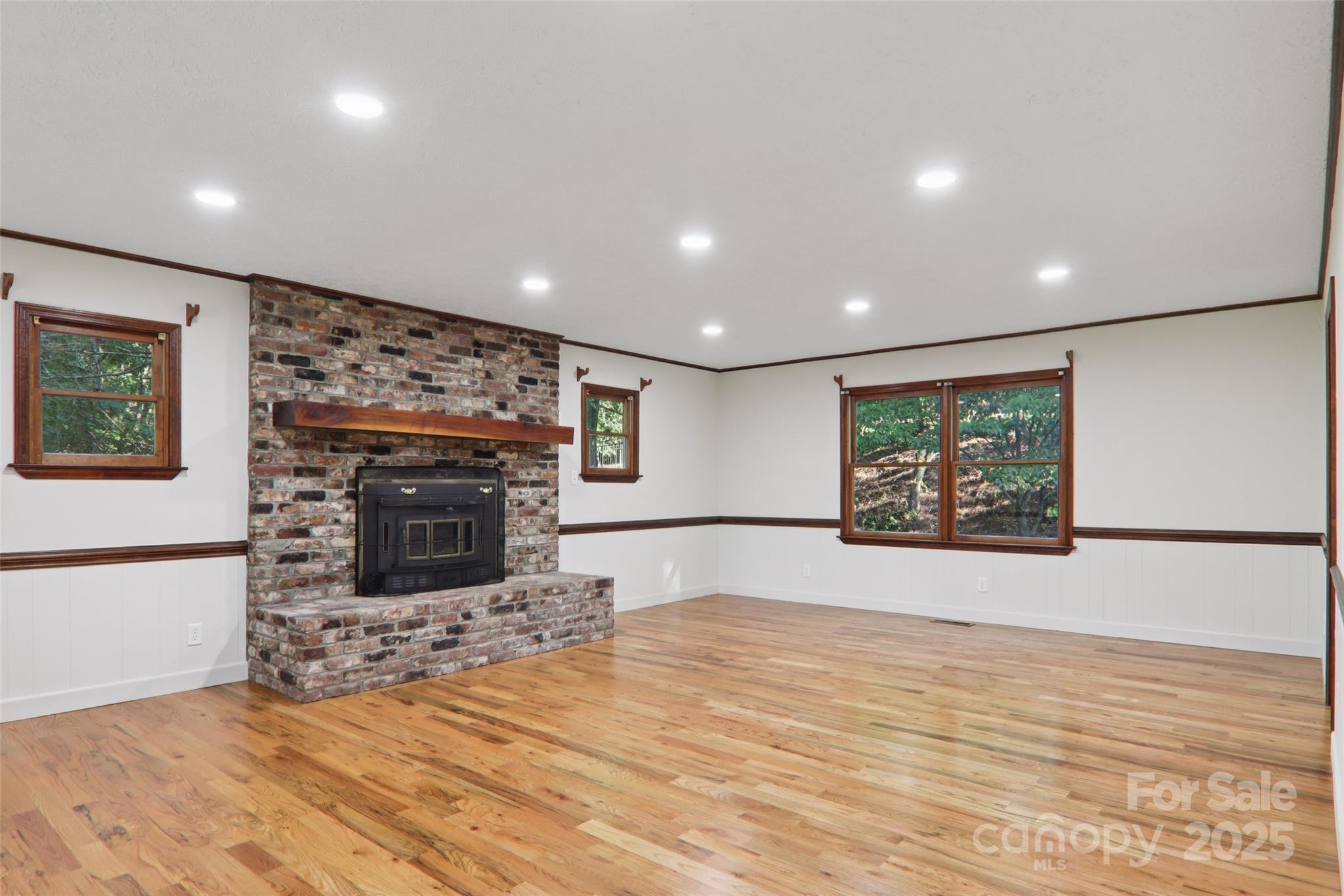 5 Timothy Lane Candler, NC 28715 - Photo 10 of 48 a view of empty room with a fireplace