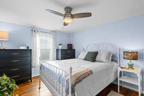 a bedroom with a bed and a dresser