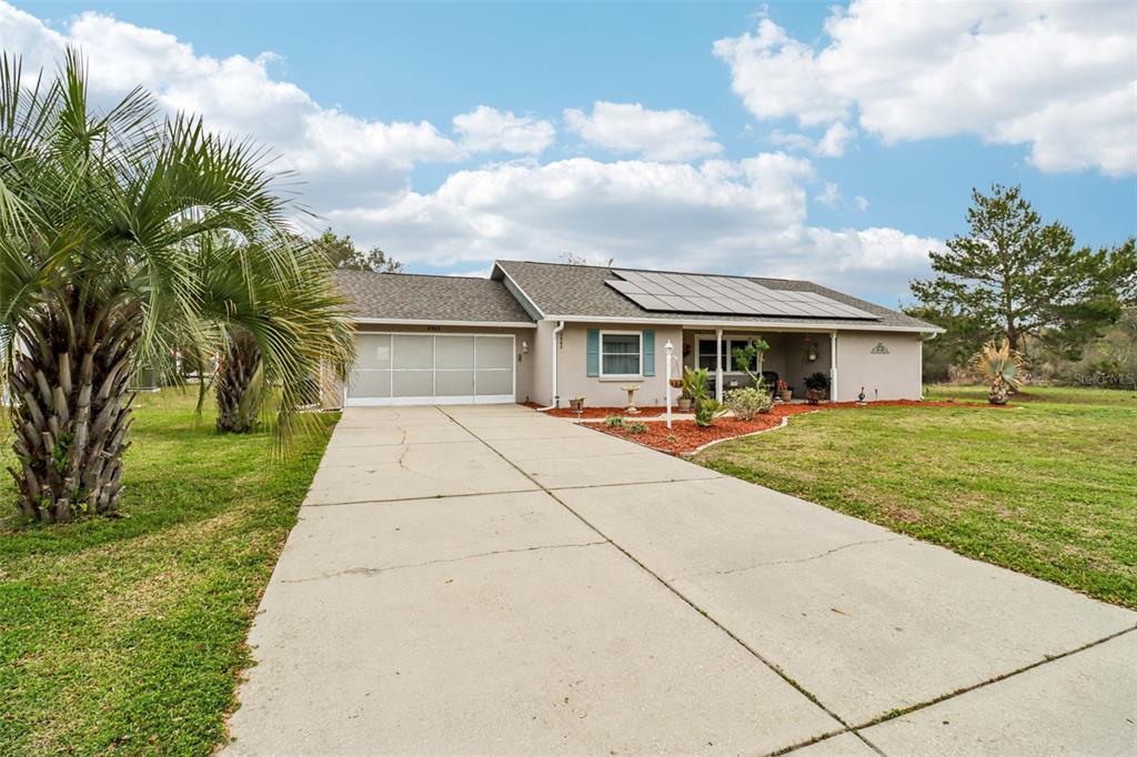 2963 Southwest 137th Place Ocala, FL 34473 - Photo 1 of 51 a view of house with a yard