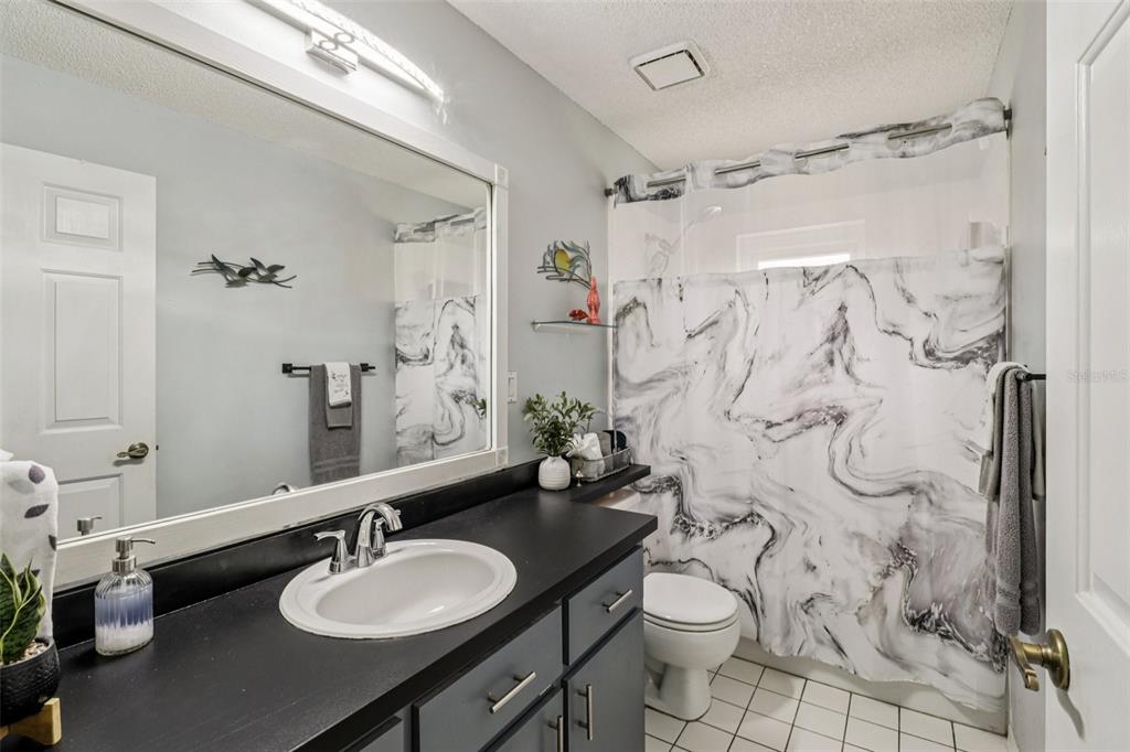 2963 Southwest 137th Place Ocala, FL 34473 - Photo 17 of 51 a bathroom with a sink toilet and shower