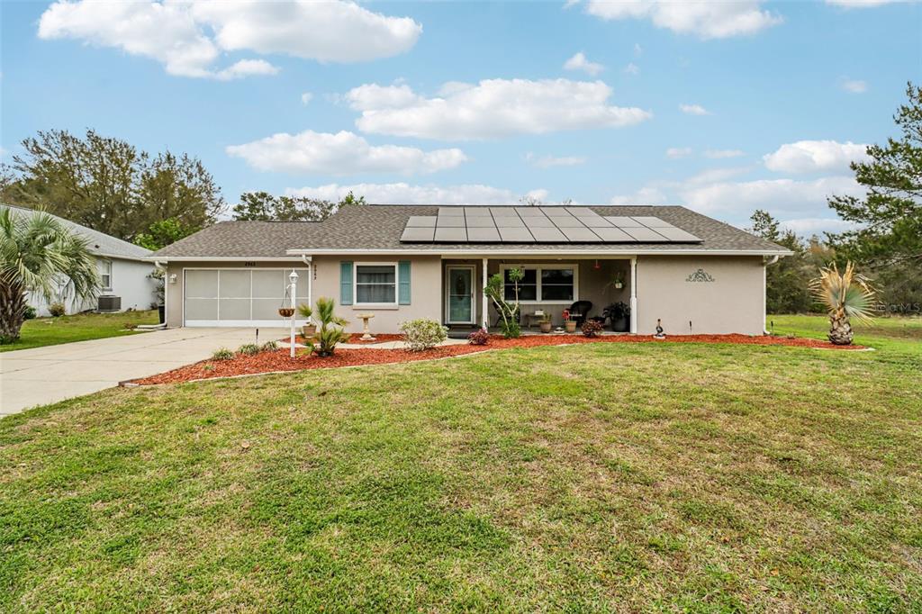 2963 Southwest 137th Place Ocala, FL 34473 - Photo 2 of 51 a front view of house with yard