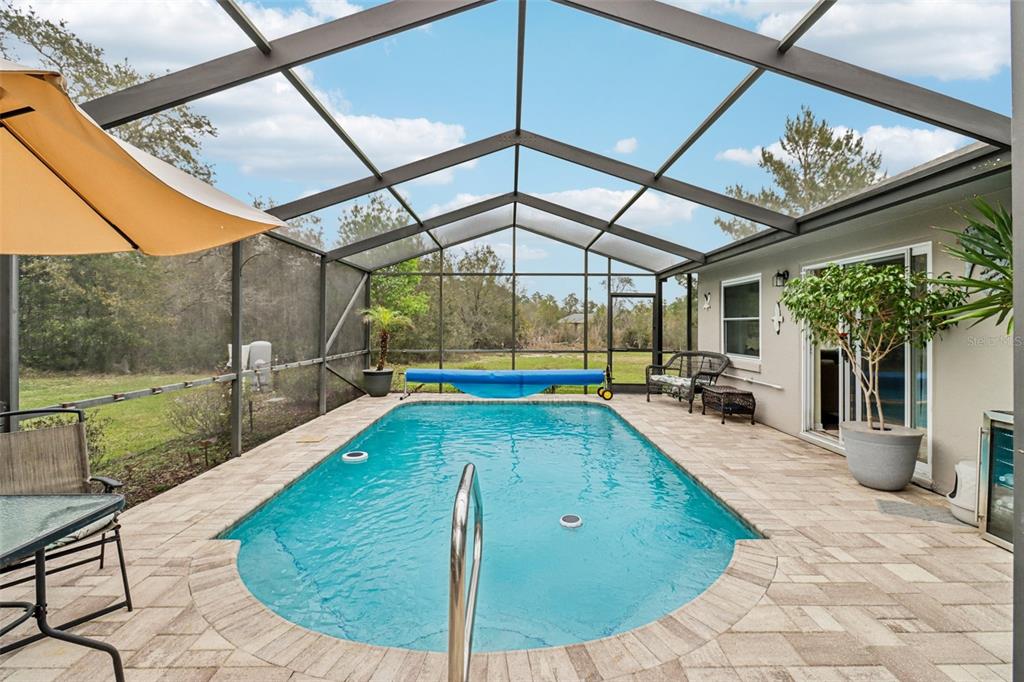 2963 Southwest 137th Place Ocala, FL 34473 - Photo 27 of 51 a view of a swimming pool with a patio