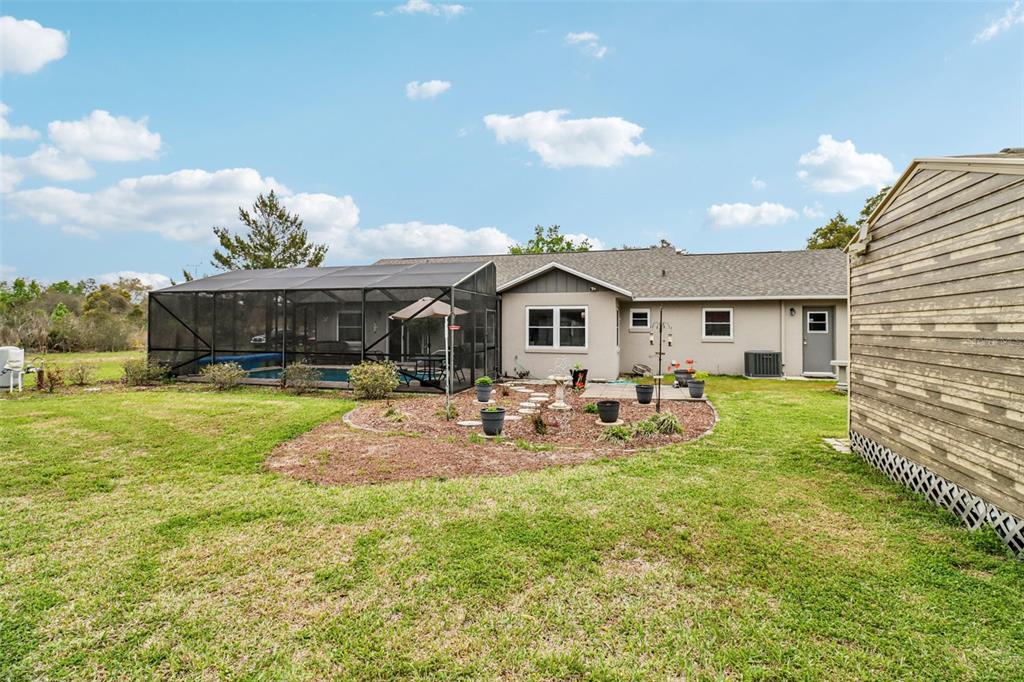 2963 Southwest 137th Place Ocala, FL 34473 - Photo 29 of 51 a view of a house with backyard and sitting area