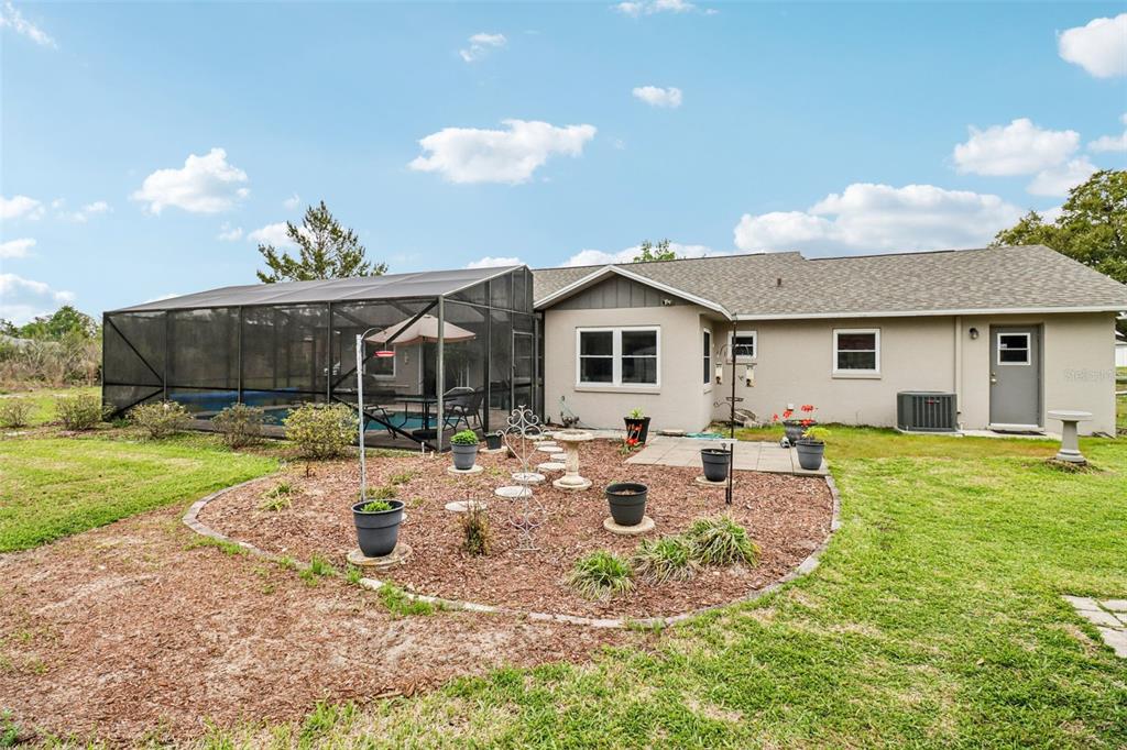 2963 Southwest 137th Place Ocala, FL 34473 - Photo 30 of 51 a view of a house with backyard and sitting area