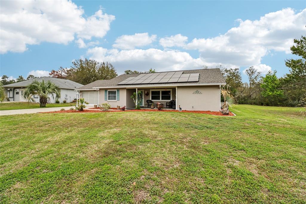 2963 Southwest 137th Place Ocala, FL 34473 - Photo 3 of 51 a front view of house with yard and seating