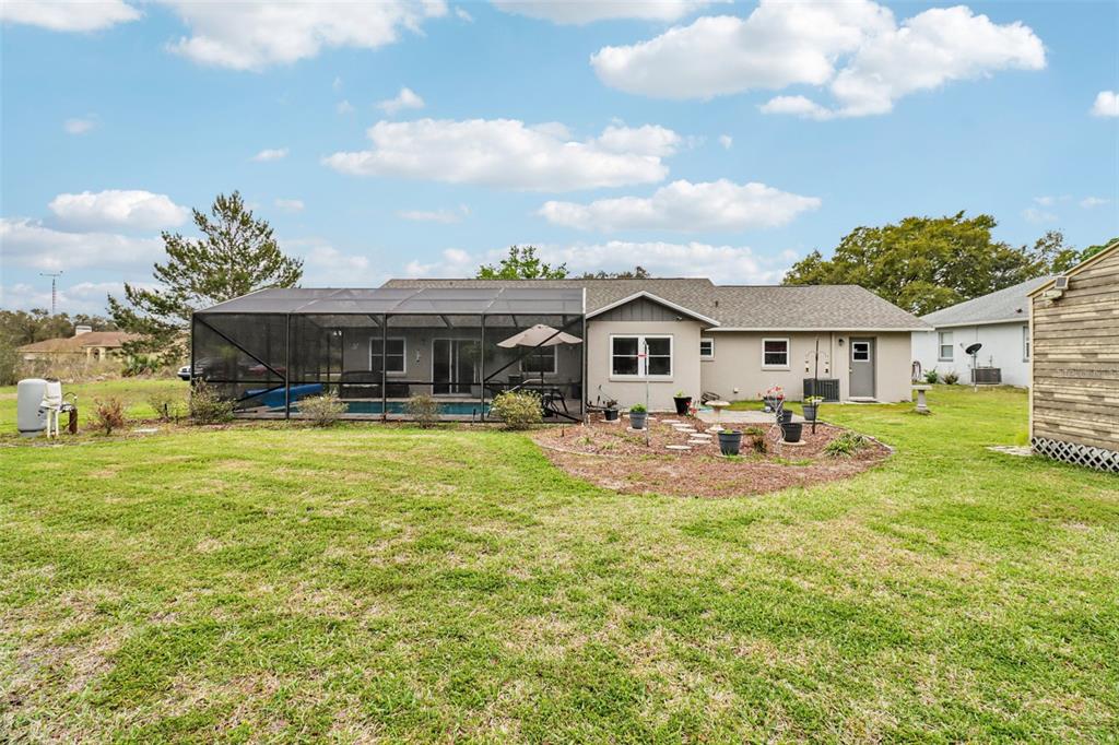 2963 Southwest 137th Place Ocala, FL 34473 - Photo 31 of 51 a view of a house with swimming pool and porch
