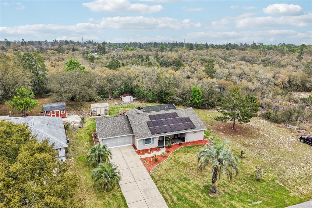 2963 Southwest 137th Place Ocala, FL 34473 - Photo 38 of 51 an aerial view of a house with a garden