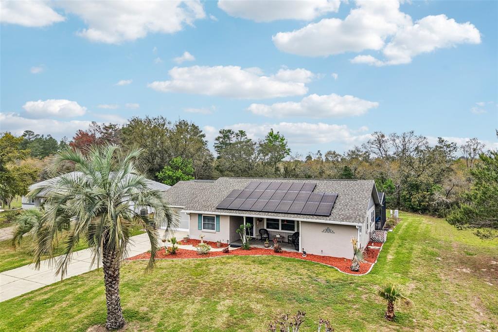 2963 Southwest 137th Place Ocala, FL 34473 - Photo 40 of 51 a view of a house with pool and a yard
