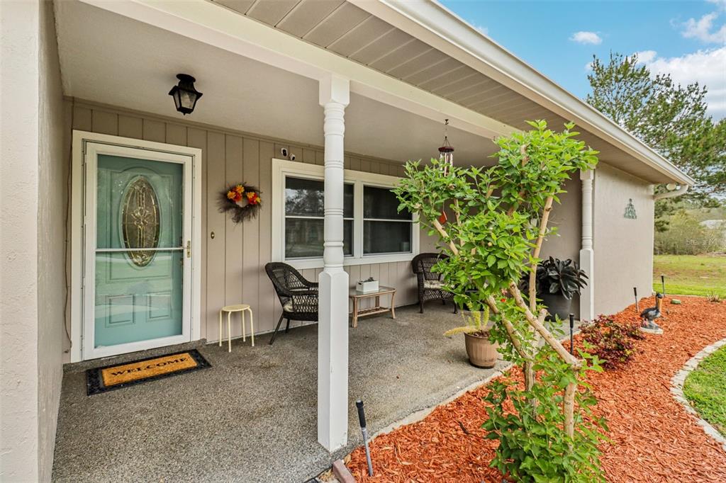 2963 Southwest 137th Place Ocala, FL 34473 - Photo 4 of 51 a backyard of a house with outdoor seating