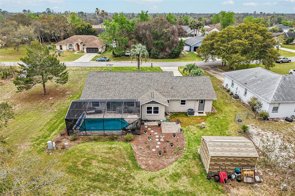 2963 Southwest 137th Place Ocala, FL 34473 - Photo 46 of 51 an aerial view of a house with a yard big trees