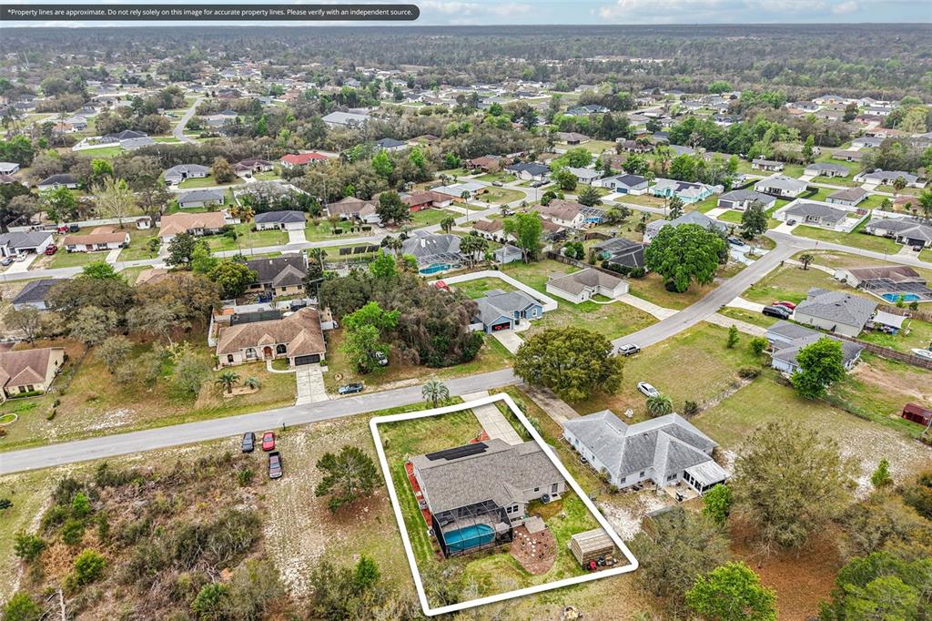 2963 Southwest 137th Place Ocala, FL 34473 - Photo 48 of 51 an aerial view of residential houses with yard