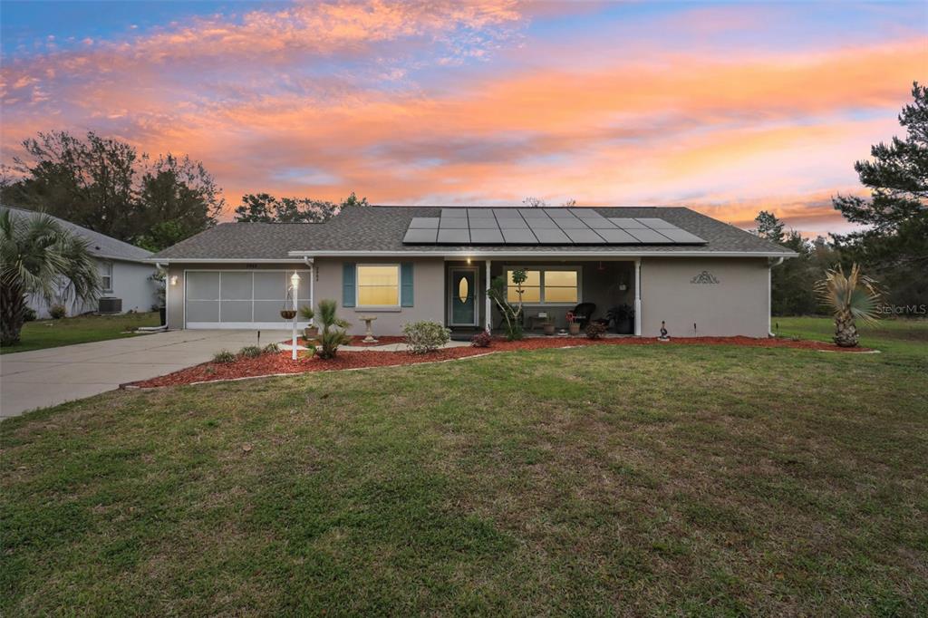 2963 Southwest 137th Place Ocala, FL 34473 - Photo 50 of 51 a front view of a house with a garden