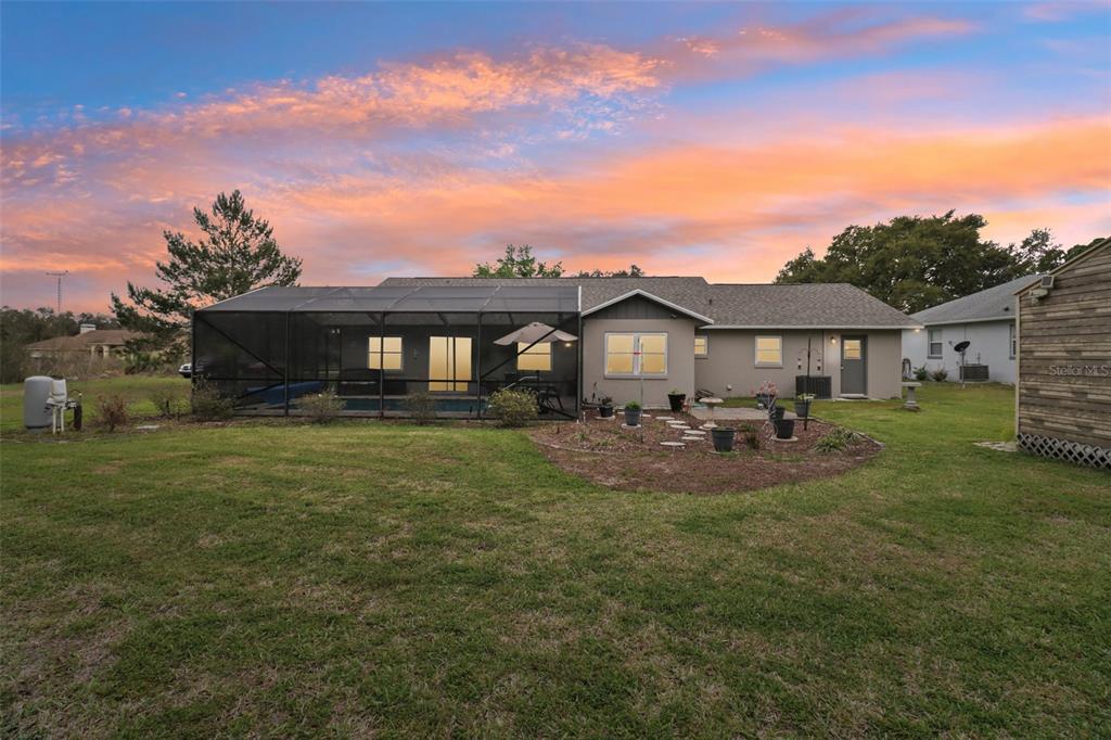 2963 Southwest 137th Place Ocala, FL 34473 - Photo 51 of 51 a front view of a house with garden