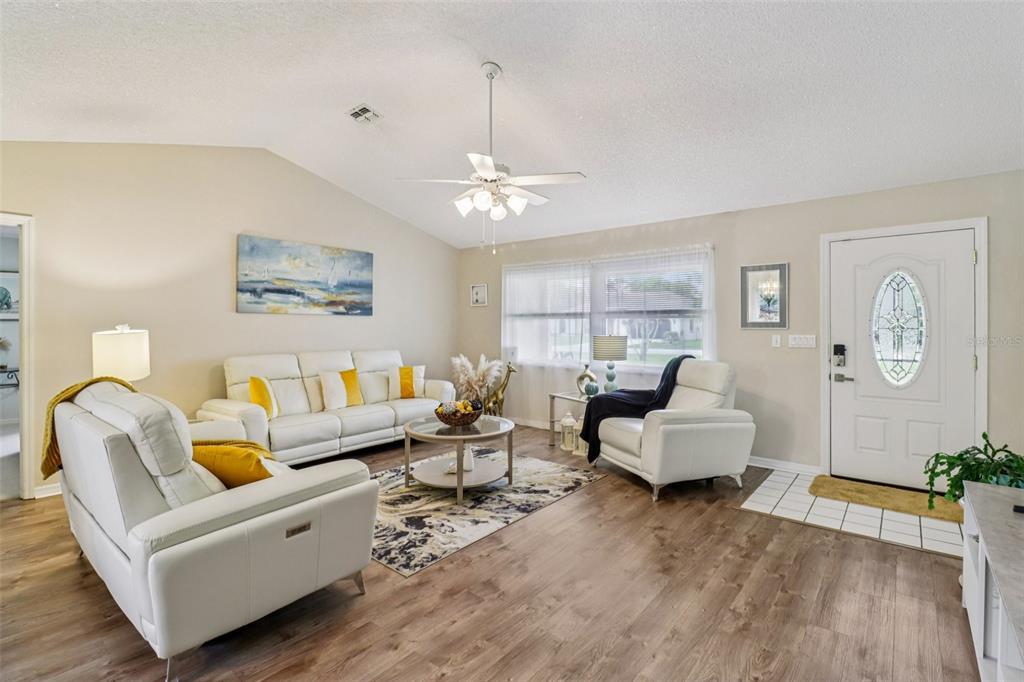 2963 Southwest 137th Place Ocala, FL 34473 - Photo 6 of 51 a living room with furniture or couch and a chandelier