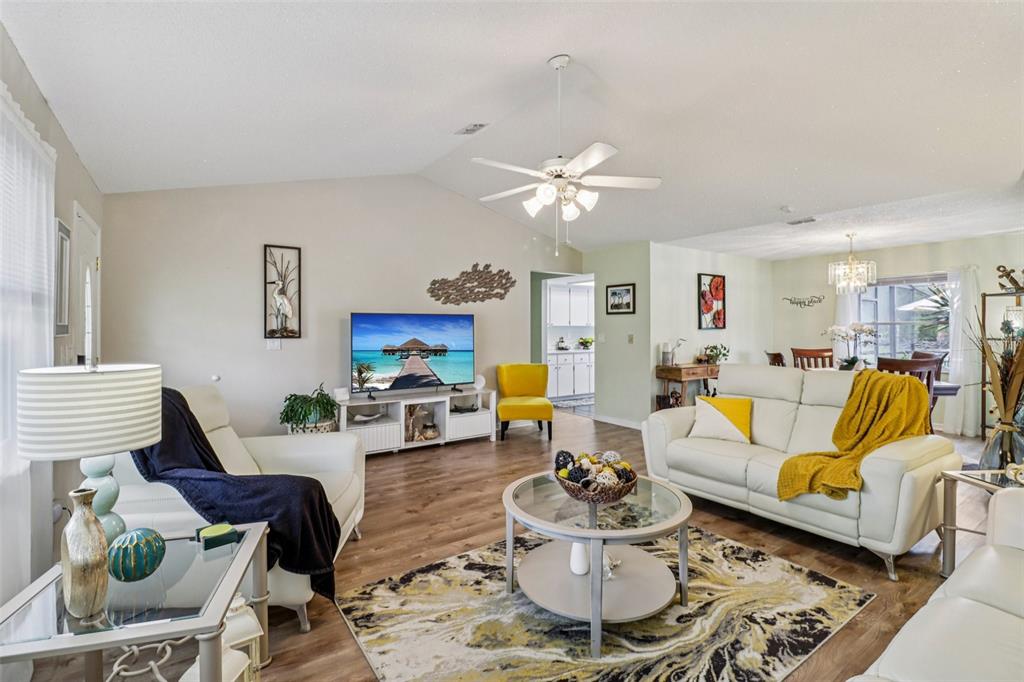 2963 Southwest 137th Place Ocala, FL 34473 - Photo 7 of 51 a living room with furniture and a chandelier