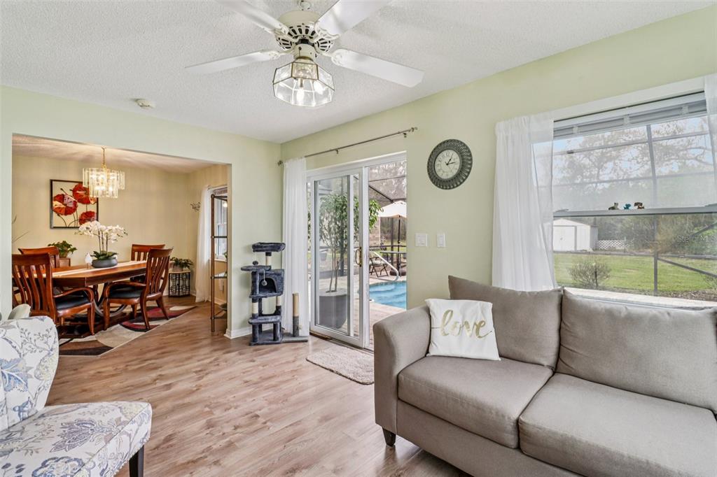 2963 Southwest 137th Place Ocala, FL 34473 - Photo 9 of 51 a living room with furniture and a large window