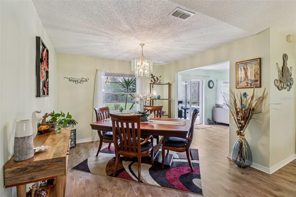 2963 Southwest 137th Place Ocala, FL 34473 - Photo 10 of 51 a view of a dining room with furniture and wooden floor