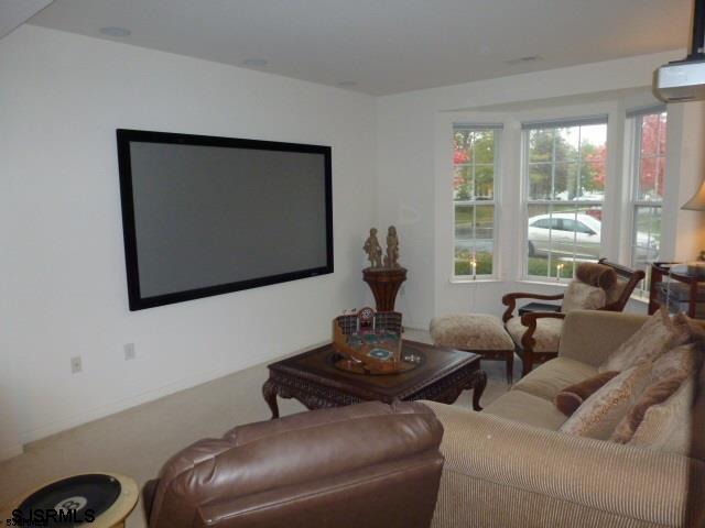11 Northampton Road, Unit FOUR SEASONS Galloway Township, NJ 08205 - Photo 6 of 13 a living room with furniture and a flat screen tv